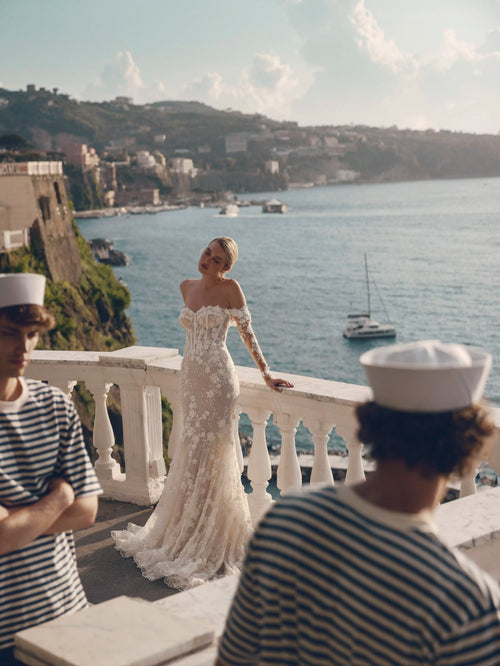 Mermaid lace wedding gown with off-the-shoulder corset bodice and floral sleeves, bespoke Ricca Sposa Noemi bridal gown