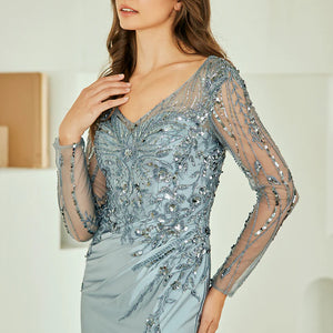 Bespoke beaded blue gown with sheer sequin sleeves and V-neck for Mother of the Bride, handcrafted wedding gown