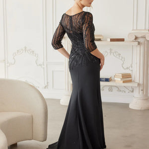Bespoke black beaded mermaid gown with sheer three-quarter sleeves and illusion back, handcrafted wedding gown
