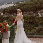 Geometric beaded Ricca Sposa Silvia fit and flare gown with spaghetti straps and tulle train, handcrafted bridal gown