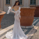 Shimmering sequin mermaid wedding dress with tulle bows and long sleeves, a bespoke Ricca Sposa Elisa bridal gown