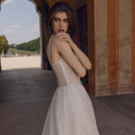 Sheer corset bodice Ricca Sposa Anetta wedding dress with linear glitter embroidery and bespoke bridal gown