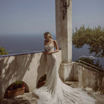 Beaded strapless mermaid gown with a long train, handcrafted Ricca Sposa Vincenza wedding dress