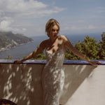 Beaded mermaid Ricca Sposa Vincenza wedding dress with peaked strapless neckline and handcrafted shimmer bridal gown