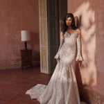 Lace trumpet wedding dress with sweetheart neckline and flared sleeves, a bespoke Ricca Sposa bridal gown