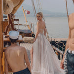 Shimmering A-line Ricca Sposa Donata wedding gown with bespoke sheer beaded back and high slit bridal gown