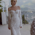 Off-the-shoulder floral lace mermaid wedding dress with long sleeves and beading, handcrafted bespoke bridal gown