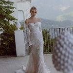 Off-the-shoulder lace mermaid wedding gown with long sleeves and shimmer, a bespoke Ricca Sposa Gina bridal gown