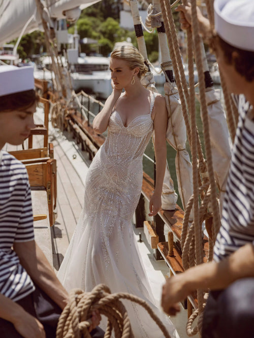 Beaded mermaid wedding gown with sunburst sequins and a sheer bodice, bespoke Ricca Sposa Celia bridal gown
