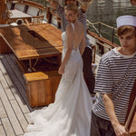 Beaded mermaid wedding dress with sheer bodice and low back, a handcrafted Ricca Sposa Celia bridal gown