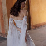 Handcrafted Ricca Sposa Cristina beaded lace wedding dress with sheer off-the-shoulder sleeves, bespoke bridal gown