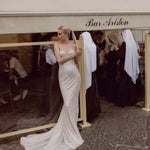Strapless sweetheart mermaid gown with shimmering silver beading and long train, bespoke Ricca Sposa wedding dress