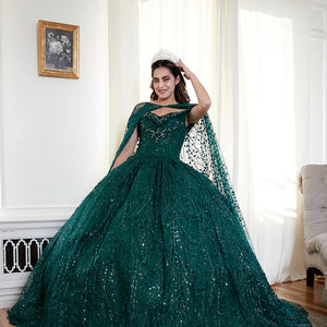 Bespoke emerald green sequined ball gown with sweetheart neckline and matching cape, handcrafted wedding dress