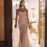 Lace mermaid wedding gown with a sheer corset bodice and high lace neckpiece, handcrafted bespoke bridal gown