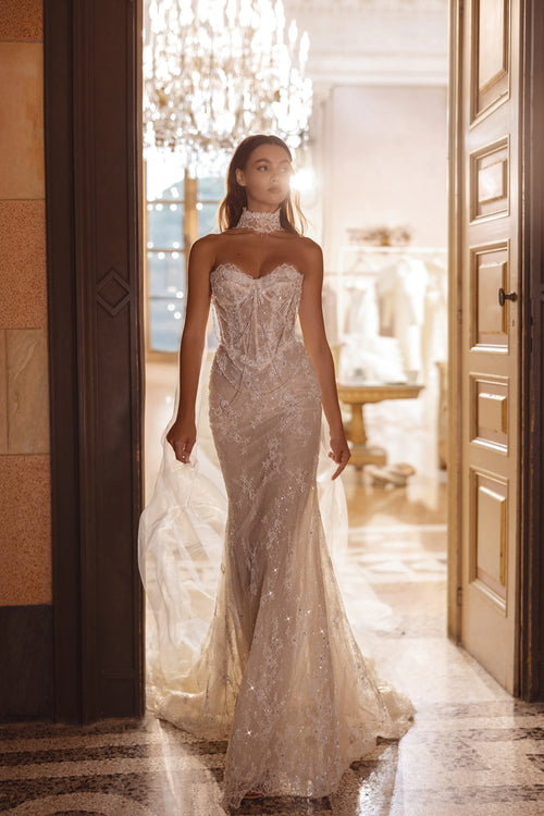 Lace mermaid wedding gown with a sheer corset bodice and high lace neckpiece, handcrafted bespoke bridal gown