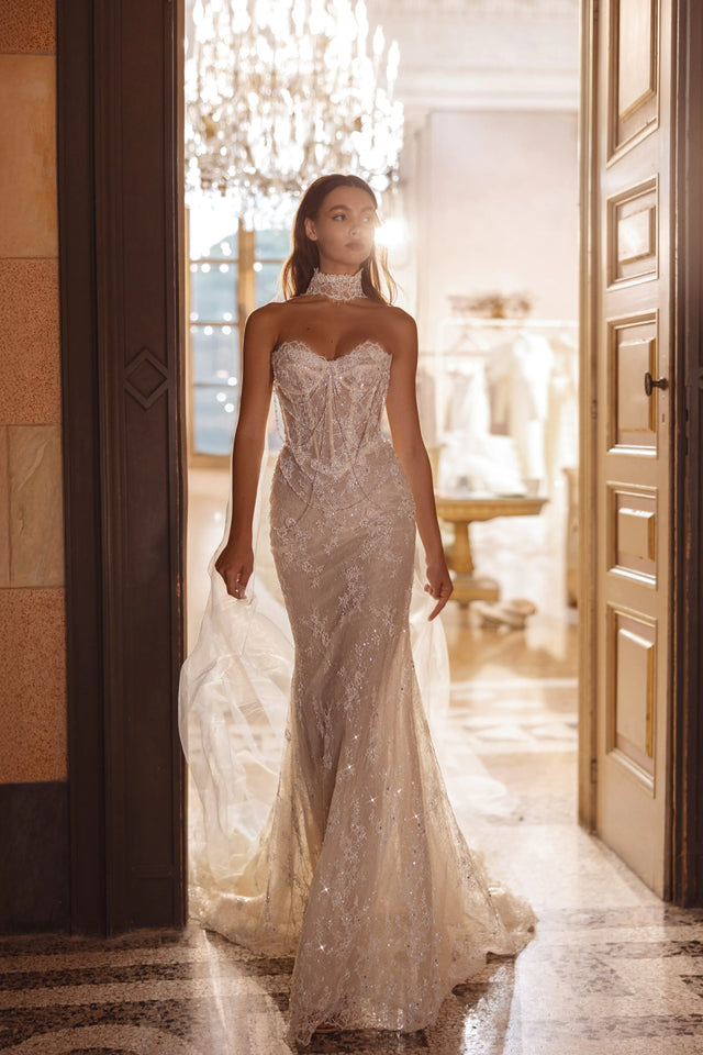 Lace mermaid wedding gown with a sheer corset bodice and high lace neckpiece, handcrafted bespoke bridal gown