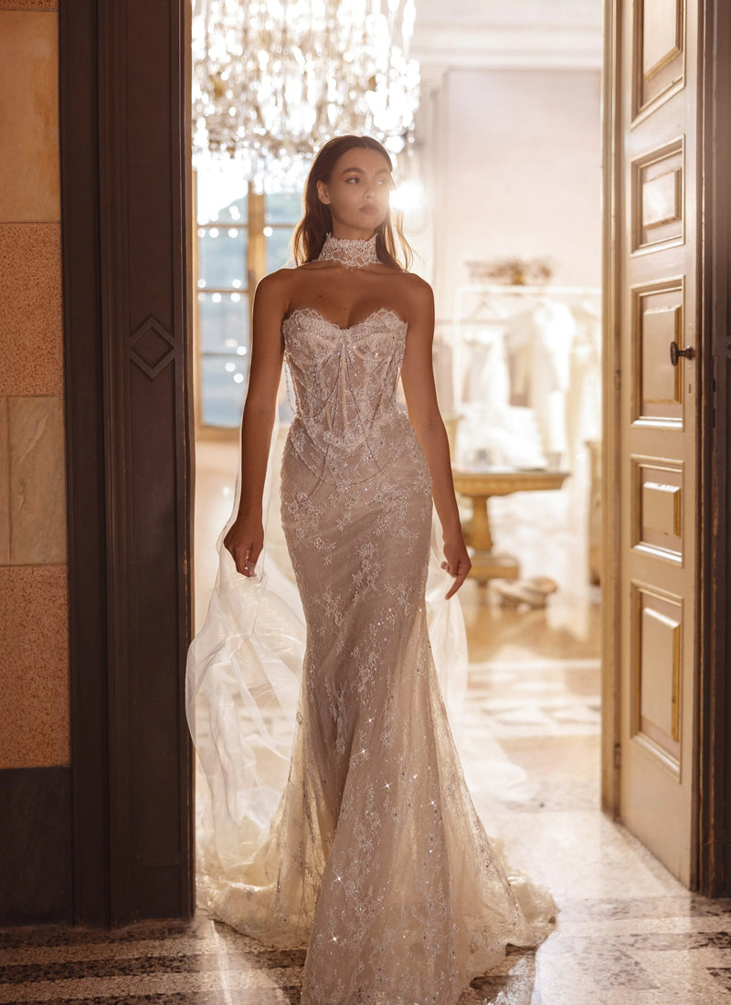 Lace mermaid wedding gown with a sheer corset bodice and high lace neckpiece, handcrafted bespoke bridal gown