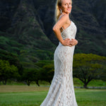 Beaded mermaid wedding dress with geometric lace, deep plunging neckline and straps, handcrafted bespoke bridal gown