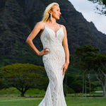 Beaded mermaid wedding dress with a deep plunging neckline and thin straps, handcrafted bespoke bridal gown