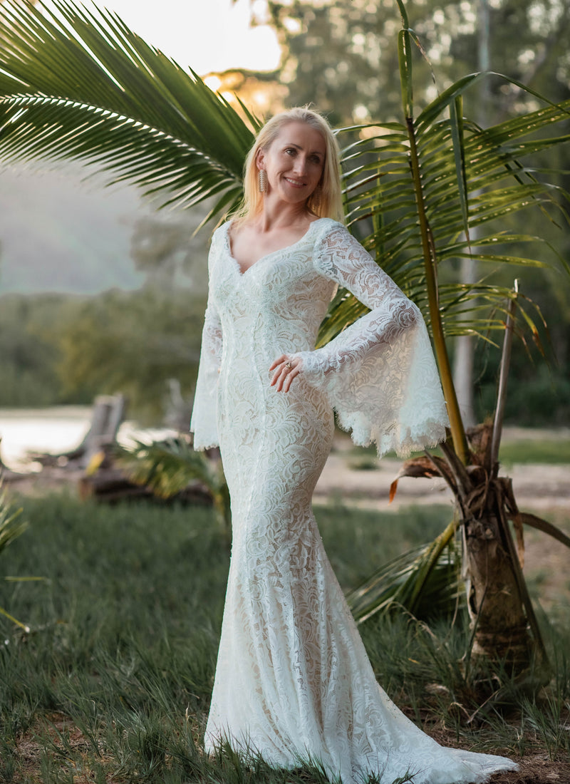 Boho mermaid lace wedding dress with scalloped V-neck and long bell sleeves, handcrafted bridal gown