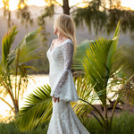 Boho lace mermaid wedding dress with long bell sleeves and a scalloped V-neck, handcrafted bridal gown