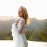 Boho mermaid lace wedding dress with long bell sleeves and scalloped V-neck, bespoke handcrafted bridal gown