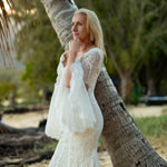 Lace mermaid wedding dress with long bell sleeves and scalloped V-neck, handcrafted boho bridal gown