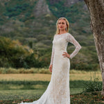 Lace mermaid wedding dress with long sleeves and boat neck, a bespoke handcrafted bridal gown.