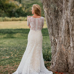 Long sleeve lace mermaid wedding dress with boat neck and button back, handcrafted bridal gown
