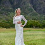 Long sleeve lace mermaid wedding dress with boat neck and floral details, handcrafted bespoke bridal gown