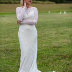 Long sleeve lace mermaid wedding dress with boat neck and floral lace details, bespoke bridal gown