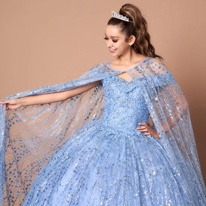 Bespoke light blue Quinceañera ball gown with a sheer glitter cape and sequined bodice, handcrafted wedding gown