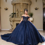 Bespoke navy off-the-shoulder Quinceañera ball gown with beaded corset and glitter tulle, handcrafted bridal gown