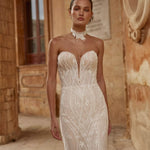Bespoke beaded strapless Ricca Sposa gown with plunging sweetheart neckline and geometric patterns, wedding dress