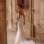 Bespoke mermaid wedding dress with handcrafted lace embroidery and a halter neck, Ricca Sposa bridal gown