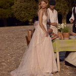 Shimmering tulle A-line wedding gown with lace V-neck bodice, Ricca Sposa Benedetta handcrafted bridal gown.