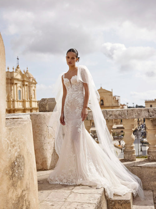 Handcrafted floral lace mermaid wedding gown with plunging sweetheart neck and tulle shoulder bows, bridal gown