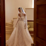Lace A-line wedding dress with sheer corset bodice, long sleeves and lace veil, handcrafted Ricca Sposa bridal gown