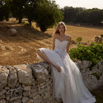 Strapless 3D floral lace bodice and layered tulle A-line skirt on a handcrafted Ricca Sposa wedding dress