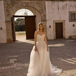Strapless A-line bridal gown with floral lace bodice and flowy tulle skirt, handcrafted Ricca Sposa wedding dress