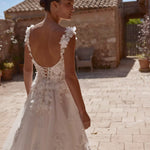 Floral 3D appliqué Ricca Sposa wedding gown with a low corset back, bespoke handcrafted bridal gown