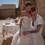 Off-the-shoulder ball gown with 3D floral lace and a sheer corset bodice handcrafted Ricca Sposa wedding dress