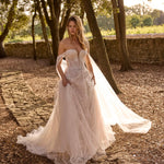 Lace A-line Ricca Sposa gown with a plunging sweetheart neckline and off-the-shoulder sleeves, bespoke wedding dress