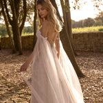 Bespoke off-the-shoulder tulle Ricca Sposa Adelina bridal gown with flowing sleeves and corset back wedding dress