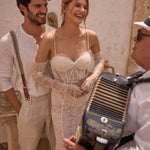 Lace mermaid bridal gown with pearl-draped corset and lace sleeves, bespoke Ricca Sposa handcrafted wedding dress