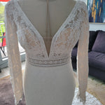 Lace mermaid wedding dress with deep plunging neckline, long sleeves and crochet waist, bespoke handcrafted bridal gown