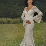 Bespoke boho mermaid crochet lace wedding dress with deep V-neck and bell sleeves, handcrafted bridal gown