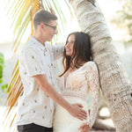 Bespoke lace mermaid wedding dress with long sleeves and deep plunging neckline, handcrafted bridal gown