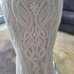 Intricate geometric beadwork on a bespoke mermaid wedding dress with plunging neckline, handcrafted bridal gown