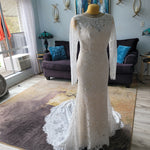 Long sleeve lace mermaid wedding dress with boat neck and scalloped train, handcrafted bridal gown